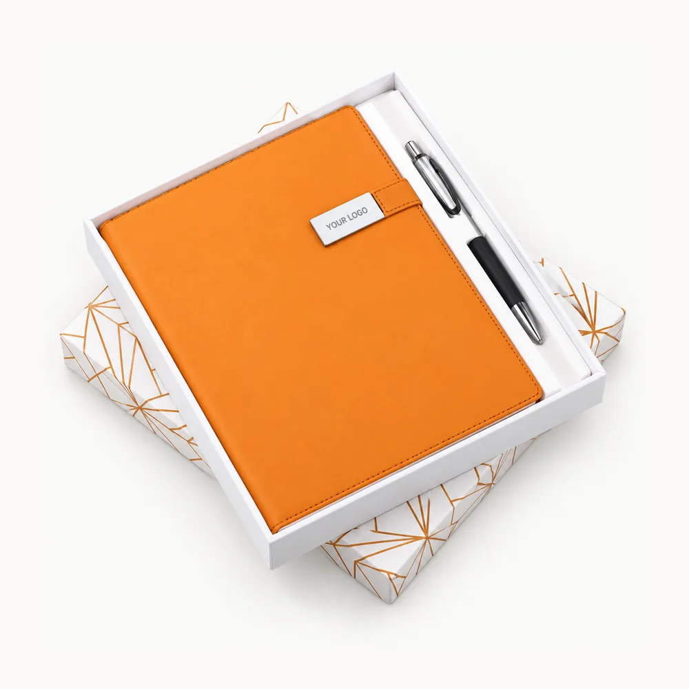 Orange notebook, pen and white presentation tray