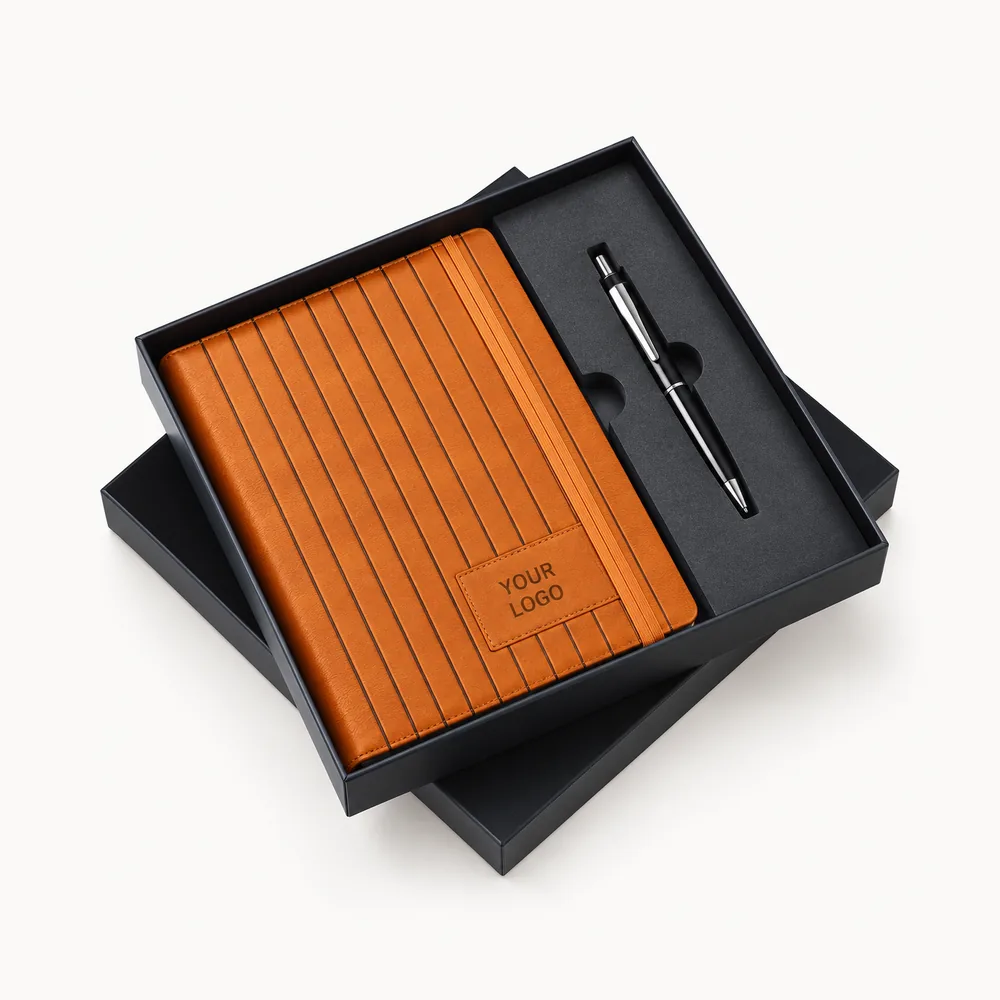 Orange ribbed notebook, pen and black presentation box